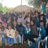 Grupo de niños, niñas, padres, cuidadores y funcionarios en el cierre del proyecto